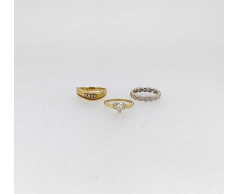 Two hallmarked 18ct gold diamond set rings, gross weight 8.3g, together with a hallmarked 14ct gold CZ ring, weight 2.1g (3)