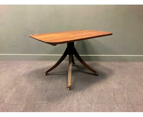 A Regency mahogany tilt-top breakfast table, the rounded rectangular top over a ring turned support raised on four splayed re