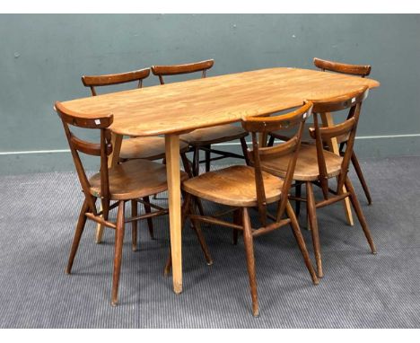 An Ercol elm dining table and six dark stained chairs, 71 x 153 x 78cmMinor shrinkage split down the middle of the table, sli