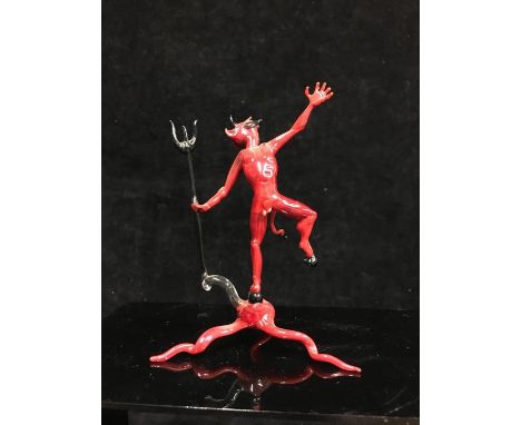 A Bimini or Istvan Komaromy style lampwork glass figure of the Devil, worked in red and black glass, he standing holding trid