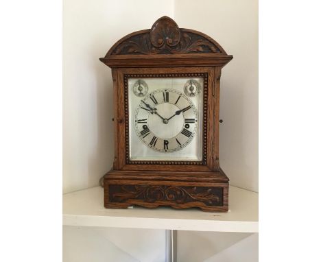 An oak bracket clock, Westminster chimes, quarter striking, circa 1900, 17.5 x 75cm x 10cm 