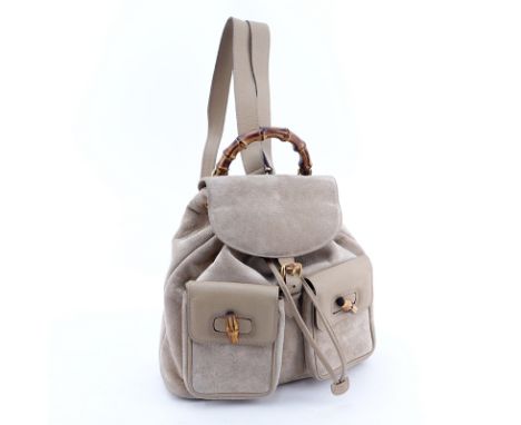 Gucci Light Beige Suede And Leather Bamboo Backpack. Brushed gold hardware, monogram fabric interior with zippered pocket. La