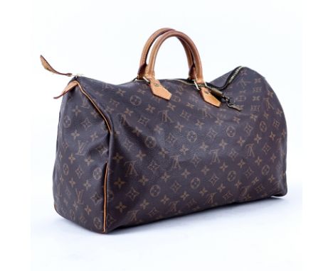 Louis Vuitton Brown Monogram Coated Canvas Speedy 40 Tote. Golden brass hardware, vachetta straps. Brown canvas interior with