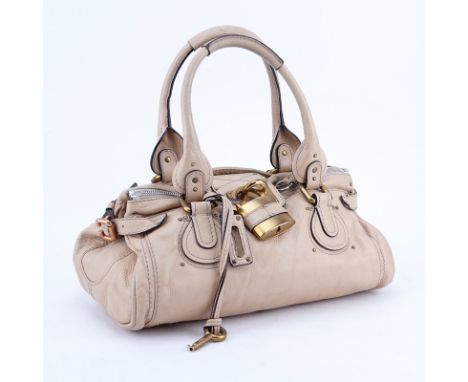 Chloe Crème/Light Beige Grained Leather Paddington MM Handbag. Brushed gold tone hardware. The interior of black canvas with 
