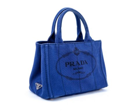 Prada Blue Canvas Denim Tote PM. Gold tone hardware. Interior of canvas with one zippered pocket and a slot pocket. Canvas sh