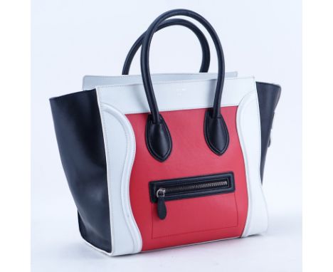 Celina Red/White And Black Tricolor Luggage Tote MM. Antique silver tone hardware, black leather interior with zippered and p