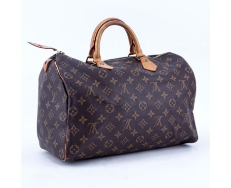 Louis Vuitton Brown Monogram Coated Canvas Speedy 35 Tote. Golden brass hardware, vachetta straps. Brown canvas interior with