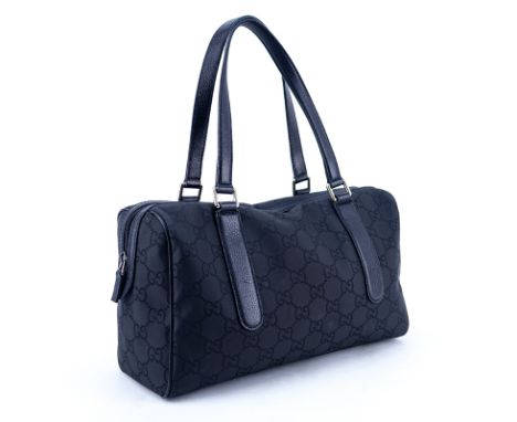 Gucci Black Monogram Nylon And Leather Signature Satchel Tote. Silver tone hardware, interior of striped fabric with zippered