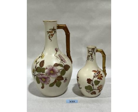 Two Royal Worcester jugs, gilded and painted with flowers. 10" high and smaller.