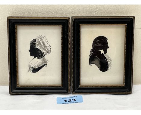 19TH CENTURY SCHOOL. A pair of portrait profile silhouettes. Initialled L.F. Watercolour. 4" x 3".