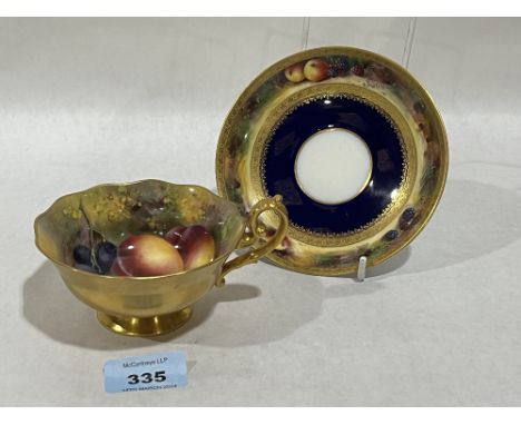 A Royal Worcester cabinet cup and saucer, painted with fruit by Edward Townsend.