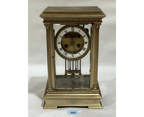 A late 19th Century French gilt brass four glass mantle clock; the drum movement with Brocot escapement striking the hours an