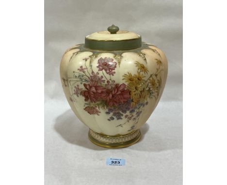 A Royal Worcester blush ivory jar and cover, gilded and painted with summer flowers. Shape 1312. 10" high.