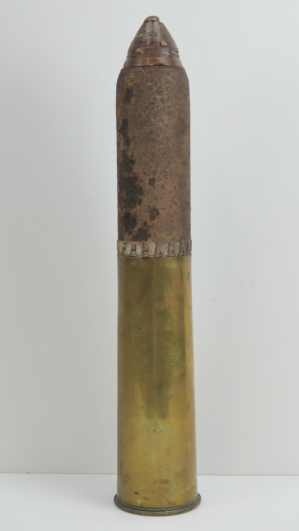 An inert British WWI 18lb high explosive shell with case, dated 1916 ...