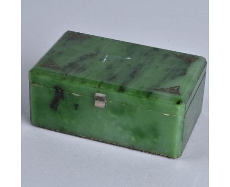 A Spinach Jade Hinged Box with Silver Mounts. Unsigned. Measures 1-1/2' x 3-3/4" x 2-3/8". Condition: Very small nicks to edg