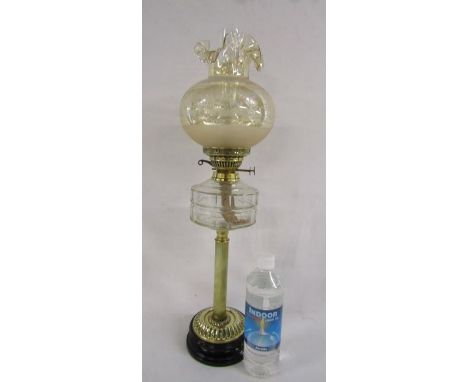 Oil lamp with glass shade and chimney also a full bottle of paraffin