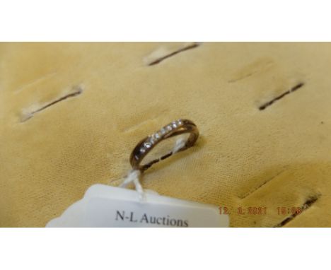 A hallmarked 9ct gold eight stone diamond ring