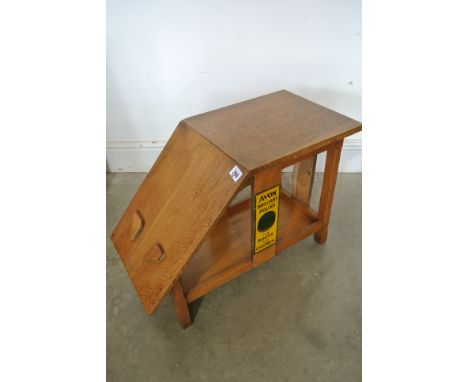 A vintage oak shoe shine stand advertising Avon Boot Polish