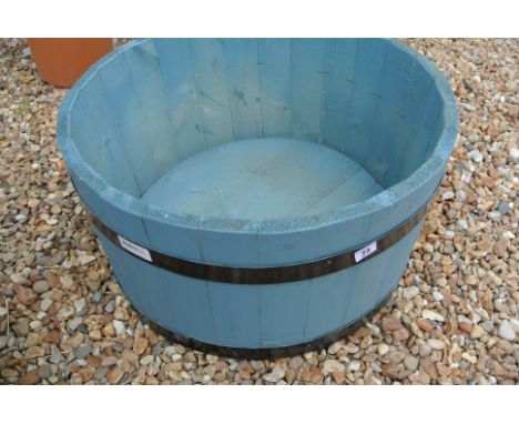 A blue wooden planter