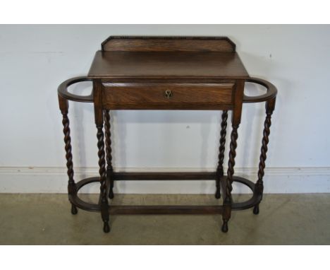 An oak barleytwist stick stand with a frieze drawer missing drip trays - Height 83cm x 89cm x 31cm