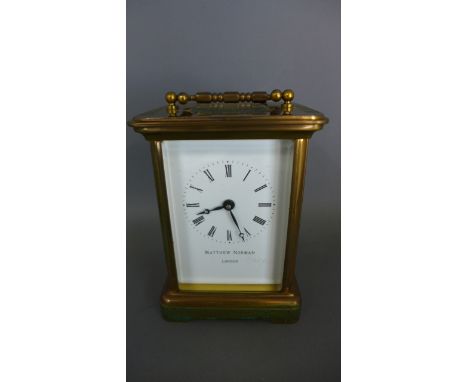 A brass carriage clock the dial signed Matthew Norman London - Height 12cm - not working, some discolouring to back
