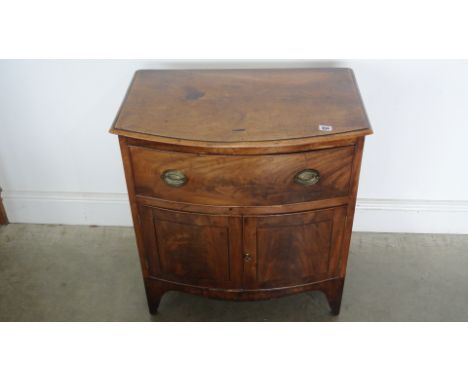 A mahogany bow fronted chest with two cupboard doors converted from a 19th century commode - Height 70cm x 66cm x 42cm