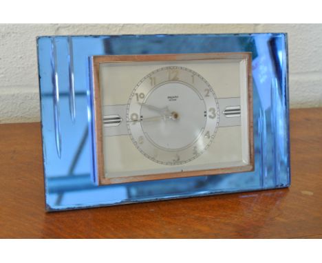 An 8 day French mantle clock by Bayard, silvered deco style dial and hands, blue glass surround - working in sale room