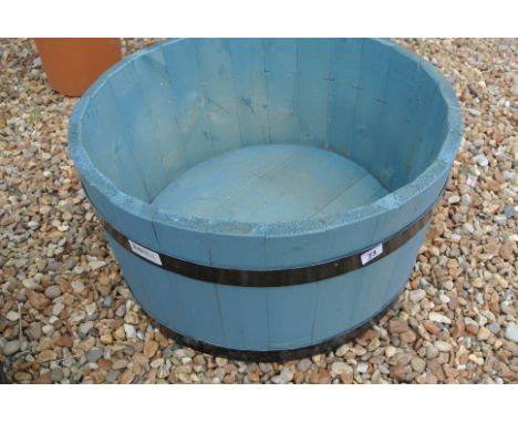 A blue wooden planter