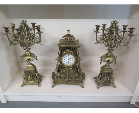 A three piece Japy Freres ormolu clock garniture with five point candelabra's - Arabic numerals to white enamel dial - all th