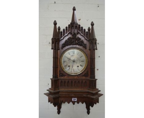 A 19th century oak Gothic bracket clock with bracket, the silvered 7 inch dial signed Cooper Son & Co Worcester - the spring 