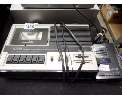 Amstrad 6030 electronic clock/radio/cassette and a Sony Walkman WM-BF40. All electrical items in this lot have been PAT teste