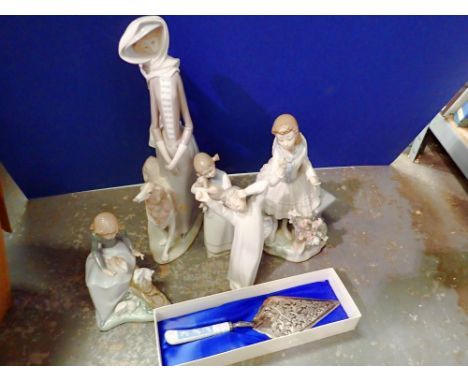 Seven Lladro and Nao figurines, with damages. Not available for in-house P&amp;P 