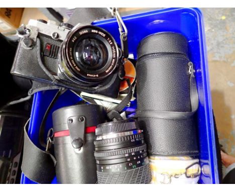 An Olympus OM-10 camera with accessories, including 2 lenses and filters. UK P&amp;P Group 2 (£20+VAT for the first lot and £