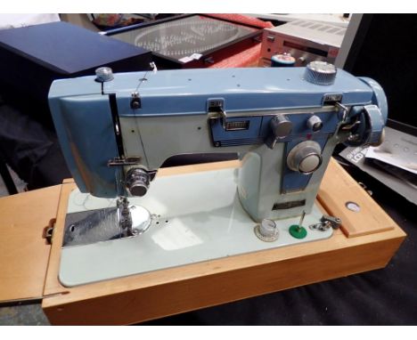 A cased Brother electric sewing machine. All electrical items in this lot have been PAT tested for safety and have passed. Th