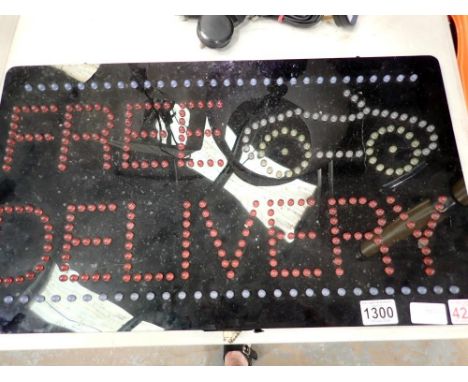 LED Xpress Free Delivery sign with 12v PSU, H: 35 cm, L: 60 cm, working at lotting. All electrical items in this lot have bee