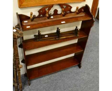 A group of assorted furniture including an open bookcase, luggage stand, folding cake stand and coat hooks