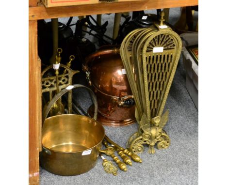 A group of copper and brass fireside tools including a coal bucket, spark guard, etc