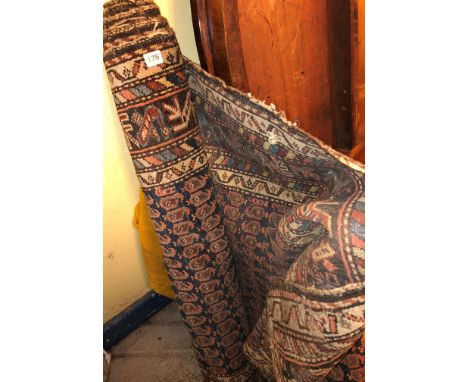 19TH CENTURY CARPET RUNNER WITH CENTRAL MEDALLION OF GULS ON A BLACK GROUND 