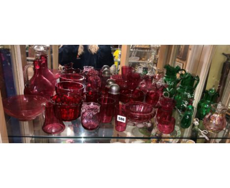 GOOD SHELF OF CRANBERRY GLASSWARE INCLUDING CLARET JUG, BOWLS, SIFTERS, ALONG WITH GREEN GLASS JUGS AND PAPERWEIGHTS