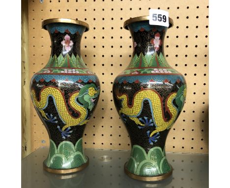 PAIR OF CLOISSONNE ENAMEL BALUSTER VASES DECORATED WITH DRAGONS ON A BLACK GROUND