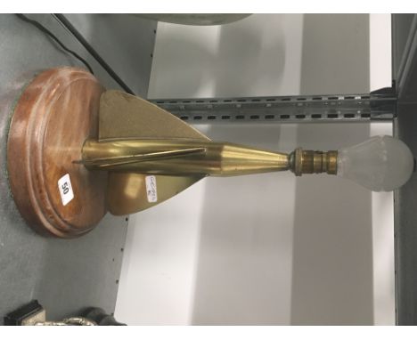 A brass ships knot measurer spinner on circular oak plaque converted as a lamp.