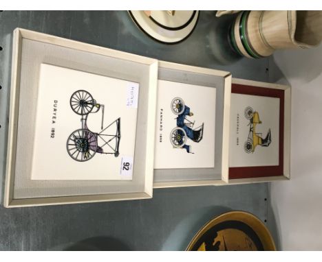 Three Poole Pottery Carters tiles depicting three classic motor vehicles: Duryea 1892, Panhard 1898 and Vauxhall 1903.