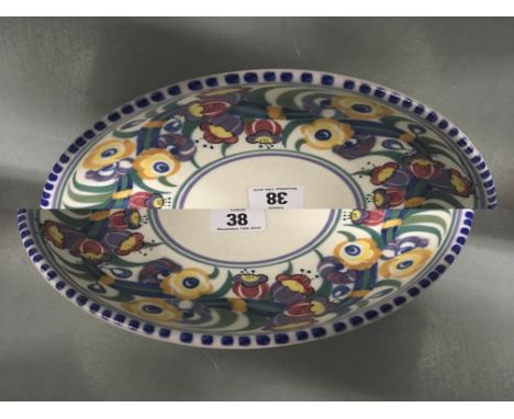 A Poole pottery Carter Stabler Adams red bodied traditional pattern footed charger, shape 495, decorated in the EF pattern.