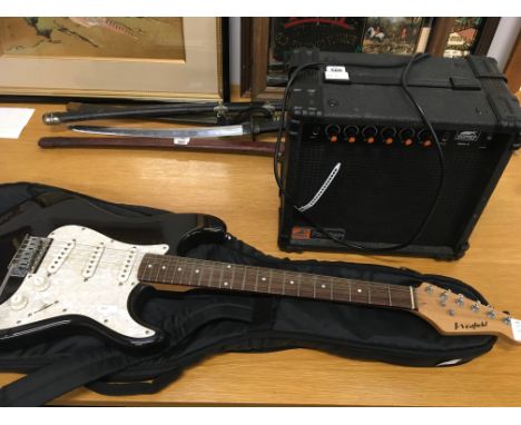 A Westfield electric guitar with mother of pearl Bakelite effect front piece and an amp.