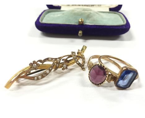 Two yellow metal rings set with a single pink and blue stone plus a 9ct gold pearl set bar brooch