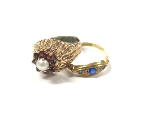 An 18 ct gold ring set with Diamonds and blue stones (2 grams) with a 9ct gold Pearl and Garnet ring (5 grams).