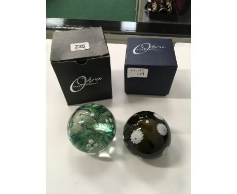 OKRA: An Art glass blossom paperweight, signed markings to base, complete with original box together with another.