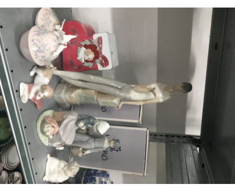 A large LLadro Spanish porcelain china figure modelled as a Young Student Boy (signed and impressed markings to base), (AF) t