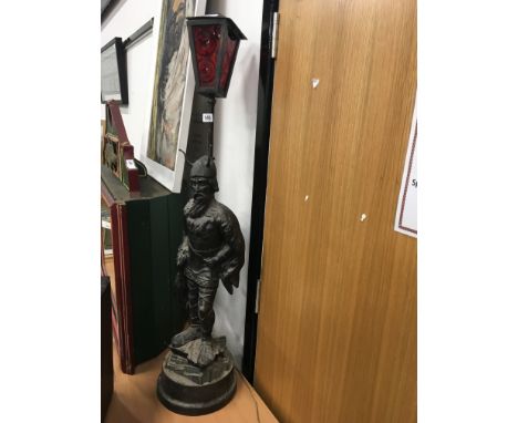 Cast iron fireside lamp designed as a Viking warrior.