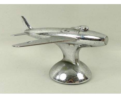 A Dunhill novelty electroplated table lighter, circa 1950, in the form of a jet aeroplane, on a domed circular base, Reg. Des